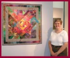 Photo of Dottie Gantt with "If It Is Not One Thing, It's ..." in the show "Eclectic Expressions: Works by Southeastern Textile Artists", Atlanta, GA in 2001