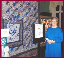 Photo of Dottie Gantt with art quilt "Twilight Garden Rain" copyright 1998, Aiken, SC